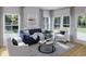 Comfortable living room with ample seating, contemporary decor, and abundant natural light at 1033 Swamp Rose Run, Summerville, SC 29485