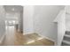 Bright entryway features hardwood floors, neutral walls, and staircase access to the second floor at 1035 Swamp Rose Run, Summerville, SC 29485