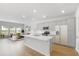 Open-concept kitchen with stainless steel appliances, an island, and views into the living room at 1035 Swamp Rose Run, Summerville, SC 29485