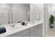 Bright bathroom featuring double sinks, a large mirror, and modern fixtures at 1037 Swamp Rose Run, Summerville, SC 29485