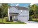 Charming two-story home with light-blue siding, well-maintained landscaping, and an attached garage at 1037 Swamp Rose Run, Summerville, SC 29485