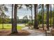 Picturesque walking path with benches winds through a peaceful wooded area at 1037 Swamp Rose Run, Summerville, SC 29485