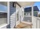Outdoor balcony with white railing, grey walls and brown wooden flooring at 1070 Moss Grove Dr, Moncks Corner, SC 29461