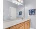 Bathroom with light wood cabinets, white quartz countertops and large mirror at 1070 Moss Grove Dr, Moncks Corner, SC 29461