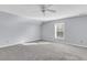 Bedroom with neutral carpet, light-grey walls, fan, and one window at 1070 Moss Grove Dr, Moncks Corner, SC 29461