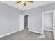 Carpeted bedroom with ceiling fan, closet, and neutral paint at 1070 Moss Grove Dr, Moncks Corner, SC 29461