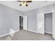 Bedroom with grey carpet, ceiling fan, and a closet with sliding doors at 1070 Moss Grove Dr, Moncks Corner, SC 29461