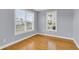 Bright bedroom with hardwood floors, two windows providing ample natural light at 1070 Moss Grove Dr, Moncks Corner, SC 29461