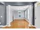 Open dining room featuring hardwood floors, columns, and a modern chandelier at 1070 Moss Grove Dr, Moncks Corner, SC 29461