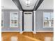 Inviting entryway featuring hardwood floors, decorative columns, and an abundance of natural light at 1070 Moss Grove Dr, Moncks Corner, SC 29461