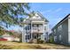 Exterior of a two-story home with a balcony and classic American charm at 1070 Moss Grove Dr, Moncks Corner, SC 29461