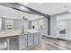 Bright kitchen featuring granite countertops, stainless steel appliances, and an open layout to living area at 1070 Moss Grove Dr, Moncks Corner, SC 29461