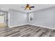 Spacious living room with a ceiling fan and recessed lighting, featuring gray walls and wood-style flooring at 1070 Moss Grove Dr, Moncks Corner, SC 29461