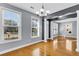 Bright living room with hardwood floors, large windows, and an open layout perfect for entertaining at 1070 Moss Grove Dr, Moncks Corner, SC 29461