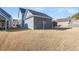 Exterior view of the home's side yard featuring a detached garage with a satellite dish at 1070 Moss Grove Dr, Moncks Corner, SC 29461