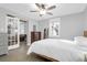 Cozy bedroom with a ceiling fan, a dresser, and access to the living room at 1117 Oceanview Rd, Charleston, SC 29412