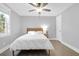 Bright bedroom with a ceiling fan, a window, and hardwood floors at 1117 Oceanview Rd, Charleston, SC 29412