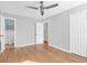 A bedroom features wood floors, a ceiling fan, and doors to closets and the adjoining bathroom at 1117 Oceanview Rd, Charleston, SC 29412