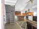 Modern kitchen features updated appliances, ample counter space, and stylish staircase, perfect for cooking and entertaining at 1117 Oceanview Rd, Charleston, SC 29412