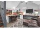 Modern kitchen with a breakfast bar, stainless steel appliances and a flat screen TV at 1117 Oceanview Rd, Charleston, SC 29412