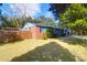 The rear exterior of this lovely home has a large backyard and a wooden fence at 1117 Oceanview Rd, Charleston, SC 29412