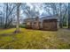 Large backyard featuring a patio, a house, and lush greenery at 112 Ravenswood Ct, Summerville, SC 29485