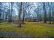 Backyard with trees and view of the house with a porch at 112 Ravenswood Ct, Summerville, SC 29485