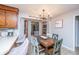 Bright dining nook featuring a distressed table, unique chairs, and a view through the bay window at 112 Ravenswood Ct, Summerville, SC 29485