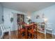 Inviting dining room with hardwood floors, a wooden table, and decor to create a cozy atmosphere at 112 Ravenswood Ct, Summerville, SC 29485
