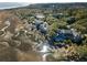 Luxury homes with mature trees and marshland views in a tranquil coastal setting with blue water at 1136 Ocean Forest Ln, Seabrook Island, SC 29455
