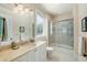 Bright bathroom featuring walk-in shower, granite countertop, and decorative towel hanger at 1136 Ocean Forest Ln, Seabrook Island, SC 29455