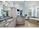 Bathroom featuring dual sinks, granite countertops, tile floors, and a soaking tub at 1136 Ocean Forest Ln, Seabrook Island, SC 29455