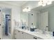 Bright bathroom featuring double vanity with marble countertop and access to a bathtub with shower at 1136 Ocean Forest Ln, Seabrook Island, SC 29455