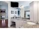 Bathroom featuring dual sinks with granite countertops, a makeup vanity, and tile floors at 1136 Ocean Forest Ln, Seabrook Island, SC 29455