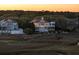 Beautiful multi-level coastal home with wrap-around porch and marsh views at sunset at 1136 Ocean Forest Ln, Seabrook Island, SC 29455