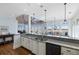 Open kitchen with granite countertops, stainless steel appliances and view to living area and dining at 1136 Ocean Forest Ln, Seabrook Island, SC 29455