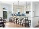 Well-equipped kitchen featuring white cabinets, stainless steel appliances, and a breakfast bar with seating at 1136 Ocean Forest Ln, Seabrook Island, SC 29455