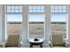 Bright living room with panoramic views, comfortable seating, and ample natural light at 1136 Ocean Forest Ln, Seabrook Island, SC 29455