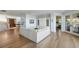 Spacious living room showcasing an open layout, hardwood floors, and custom built-ins for storage at 1136 Ocean Forest Ln, Seabrook Island, SC 29455
