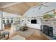 Open-concept living area boasts a fireplace, built-ins, and seamless flow to dining and kitchen spaces at 1136 Ocean Forest Ln, Seabrook Island, SC 29455