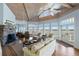 Inviting living room features vaulted ceilings, stone fireplace, and panoramic views of the surrounding landscape at 1136 Ocean Forest Ln, Seabrook Island, SC 29455