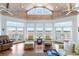 Bright sunroom with high ceilings, scenic views and elegant seating at 1136 Ocean Forest Ln, Seabrook Island, SC 29455