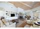 Bright and airy living room featuring built-in shelving, stone fireplace, and comfortable seating at 1136 Ocean Forest Ln, Seabrook Island, SC 29455