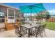 Inviting backyard patio area featuring an umbrella table and chairs for outdoor dining at 117 Swan Dr, Summerville, SC 29485