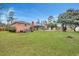Expansive backyard with a well-maintained lawn, swimming pool, and patio, creating an ideal outdoor retreat at 117 Swan Dr, Summerville, SC 29485
