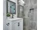 Modern bathroom featuring a glass shower, gray tile, and stylish vanity with a bronze faucet at 117 Swan Dr, Summerville, SC 29485