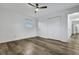 Bedroom featuring hardwood floors, a ceiling fan, and large closet, offering ample storage space at 117 Swan Dr, Summerville, SC 29485
