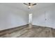 Bright bedroom features wood floors, a modern ceiling fan, and a closet, offering ample storage space at 117 Swan Dr, Summerville, SC 29485