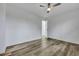 Bright bedroom offers ample space, modern ceiling fan, wood floors, and an open closet, perfect for relaxing at 117 Swan Dr, Summerville, SC 29485