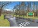 Community kayak launch features gate access, a lush green landscape, and signage at 117 Swan Dr, Summerville, SC 29485